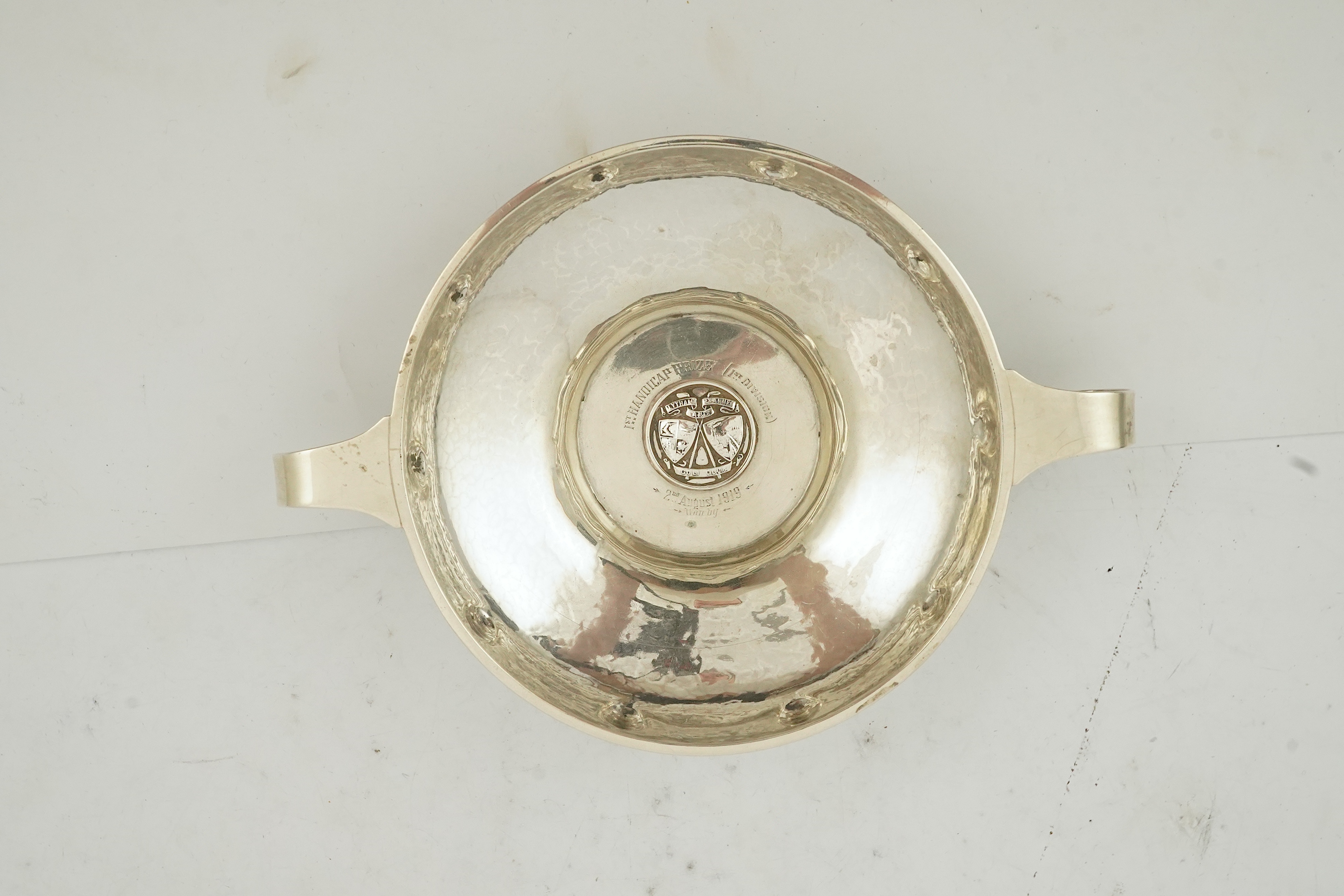 A George V Arts & Crafts planished silver golf related presentation quaich. by Albert Edward Jones